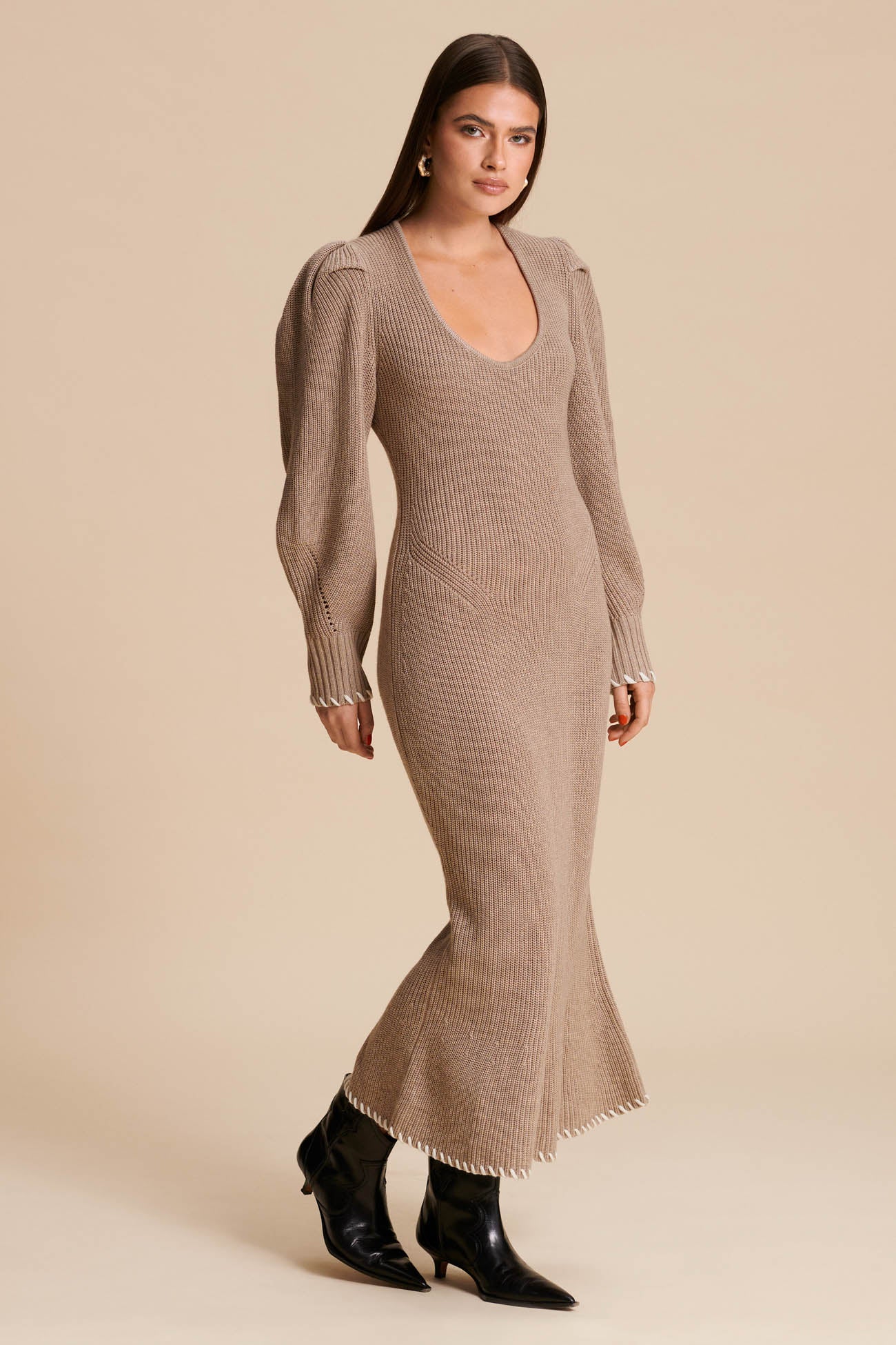 Knitted. Midi dress. Long dress. Visible stitches at the bust. Knitted. Beige. Puffy Arms. Knitted Dress. image