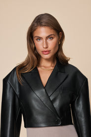 Cropped blazer. Long sleeves. Button. Collar. Obliquely cut. Black. Fake leather. Spring blazer. Summer blazer. thumbnail image